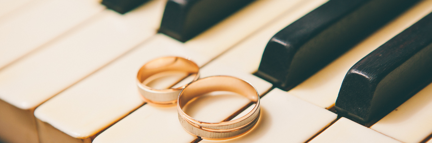 wedding rings on piano